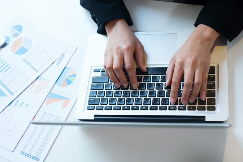 Business working in office concept. Typing hands.
