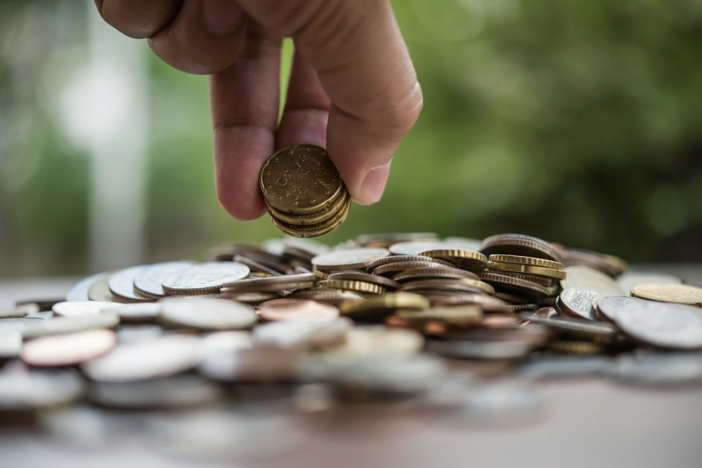 Saving money concept . hand putting money coin stack